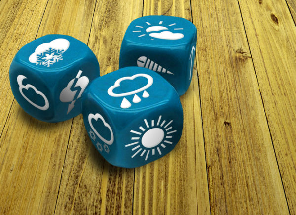 Blue dice showing different weather patterns on each side