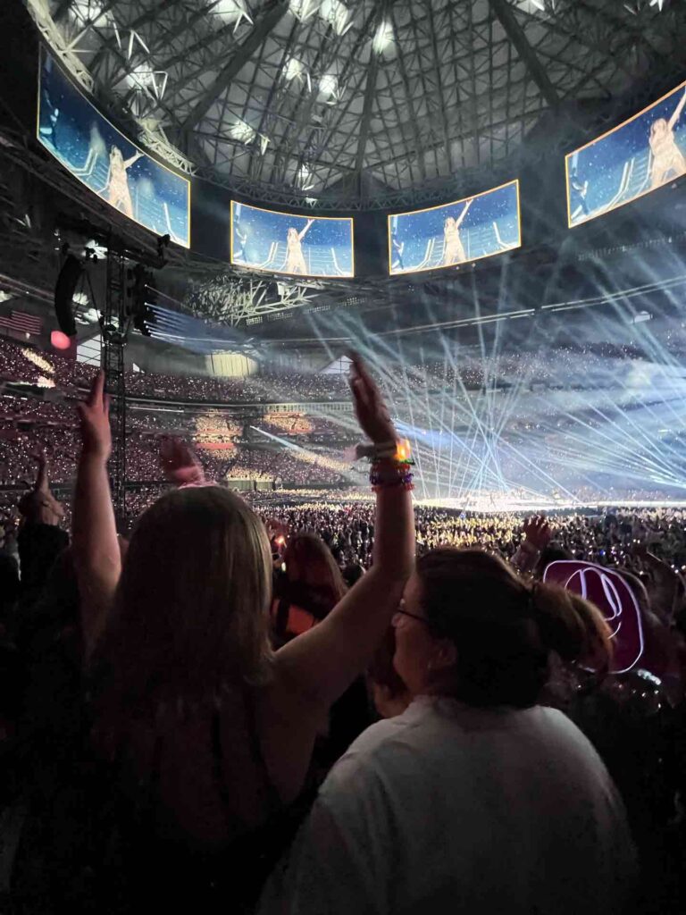 Taylor Swift fan raises hands during concert in Atlanta